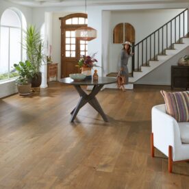 woman in entry way standing on luxury vinyl floor