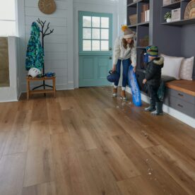 woman and child tracking snow into LVP floor