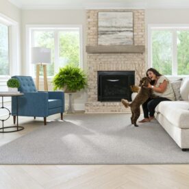 LVP in living room with woman and dog